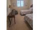 Bedroom with two twin beds, a side table, and a comfortable armchair at 24028 Park Place S Dr # 32, Punta Gorda, FL 33980