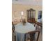 Cozy dining room area with seating for four around an oval table, and a china cabinet at 24028 Park Place S Dr # 32, Punta Gorda, FL 33980