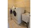 Laundry room equipped with a washer, dryer, and utility sink at 24028 Park Place S Dr # 32, Punta Gorda, FL 33980