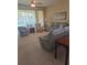 Bright living room with a large window, comfortable seating and carpet flooring at 24028 Park Place S Dr # 32, Punta Gorda, FL 33980