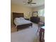 Comfortable main bedroom with carpet flooring, a large window, and ample closet space at 24028 Park Place S Dr # 32, Punta Gorda, FL 33980