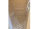 Roll-in shower with grab bars and decorative tile floor at 24028 Park Place S Dr # 32, Punta Gorda, FL 33980