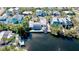 Aerial view of the home with solar panels, pool, and waterfront location at 306 68Th St, Holmes Beach, FL 34217