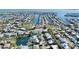 An aerial view of the home surrounded by lush landscaping near the bay at 306 68Th St, Holmes Beach, FL 34217