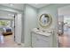 Bathroom with vanity, mirror, and walk-in shower, with views to the bedroom and bunk-bed room at 306 68Th St, Holmes Beach, FL 34217
