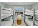 Bedroom with built-in bunk beds and a window view of the backyard at 306 68Th St, Holmes Beach, FL 34217