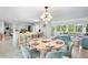 Elegant dining area with modern lighting and a view of the waterfront living space at 306 68Th St, Holmes Beach, FL 34217