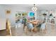 Dining area with modern decor and an open layout, connected to the kitchen and living space at 306 68Th St, Holmes Beach, FL 34217