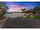 Charming single-story home with a paver driveway, attached garage, and well-manicured lawn at 306 68Th St, Holmes Beach, FL 34217