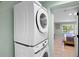 Stacked washer and dryer installation with views to the bedroom at 306 68Th St, Holmes Beach, FL 34217