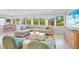 Inviting living area with comfortable seating, scenic waterfront views, and modern decor in a serene and stylish home at 306 68Th St, Holmes Beach, FL 34217