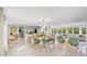 Bright, open-concept living and dining area with stylish furnishings and waterfront views at 306 68Th St, Holmes Beach, FL 34217