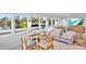 Inviting open-concept living area with waterfront views, comfortable seating, and stylish decor in a serene setting at 306 68Th St, Holmes Beach, FL 34217