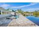 Beautiful pool with waterfront access provides a serene and luxurious experience at 306 68Th St, Holmes Beach, FL 34217