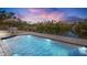 Inviting waterfront pool with lounge chairs and a tranquil view of the surrounding nature at 306 68Th St, Holmes Beach, FL 34217