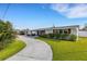 Lovely home with a well-kept lawn and an inviting driveway, perfect for easy access and showcasing its charm at 3219 Florida Blvd, Bradenton, FL 34207