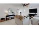 Inviting living room with neutral tones, ceiling fan, and a comfortable sofa, creating a relaxing atmosphere at 3219 Florida Blvd, Bradenton, FL 34207