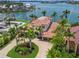 Stunning waterfront estate boasts lush tropical landscaping and a private dock for boating and waterfront enjoyment at 3576 San Remo Ter, Sarasota, FL 34239