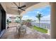 Inviting outdoor balcony with a tiled floor, seating, and scenic views, perfect for relaxation and entertaining at 3576 San Remo Ter, Sarasota, FL 34239