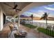 Relaxing outdoor balcony with comfortable seating and stunning water views at sunset at 3576 San Remo Ter, Sarasota, FL 34239