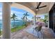 Beautiful tiled balcony with comfortable seating overlooking picturesque waterfront views, a perfect outdoor retreat at 3576 San Remo Ter, Sarasota, FL 34239