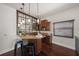 Indoor bar area featuring granite countertops, wooden cabinets, and bar stool seating at 3576 San Remo Ter, Sarasota, FL 34239