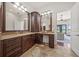 Bathroom featuring double vanity, wood cabinets and drawers, with access to waterfront views at 3576 San Remo Ter, Sarasota, FL 34239