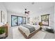 Modern bedroom with a waterfront view from the bed and featuring decor art at 3576 San Remo Ter, Sarasota, FL 34239