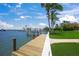 Private boat dock on the intercoastal waterway with boat lift and jet ski lift and landscaped lawn at 3576 San Remo Ter, Sarasota, FL 34239