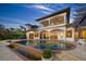Beautiful home exterior featuring a pool, multiple balconies and manicured landscaping at 3576 San Remo Ter, Sarasota, FL 34239