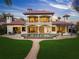 Stunning two-story home boasts a private pool, lush lawn, and Mediterranean-style architecture for luxurious outdoor living at 3576 San Remo Ter, Sarasota, FL 34239