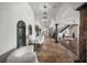 Spacious foyer featuring travertine floors, a staircase, and elegant interior design at 3576 San Remo Ter, Sarasota, FL 34239
