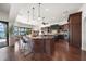 Gourmet kitchen boasts a large island with seating, pendant lighting, and views of the water at 3576 San Remo Ter, Sarasota, FL 34239