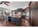 Spacious kitchen featuring custom cabinetry, high-end stainless steel appliances and large island at 3576 San Remo Ter, Sarasota, FL 34239