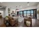 Elegant living room boasting a fireplace, hardwood flooring, and large windows overlooking the bay and private dock at 3576 San Remo Ter, Sarasota, FL 34239