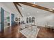 Expansive office space with hardwood floors, beamed ceiling, arched windows, and contemporary decor at 3576 San Remo Ter, Sarasota, FL 34239