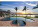 Stunning backyard pool and spa area featuring lush landscaping and water views at sunset at 3576 San Remo Ter, Sarasota, FL 34239