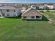 Aerial view of a home with a spacious lawn, and a covered patio at 3834 Silver Strand Trl, Palmetto, FL 34221