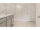 Bright bathroom featuring a walk-in shower and a vanity with marble countertops at 3834 Silver Strand Trl, Palmetto, FL 34221
