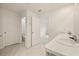 Bright bathroom with double vanity, marble countertop, and tile flooring at 3834 Silver Strand Trl, Palmetto, FL 34221