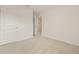 Carpeted bedroom showing a doorway to another room, white walls at 3834 Silver Strand Trl, Palmetto, FL 34221