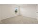 Clean bedroom with a window, neutral carpeting, and ample natural light at 3834 Silver Strand Trl, Palmetto, FL 34221
