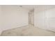 Carpeted bedroom featuring neutral walls and a doorway leading to another room at 3834 Silver Strand Trl, Palmetto, FL 34221