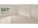 Bedroom with large window, tile floors and a view of the pond and fountain at 3834 Silver Strand Trl, Palmetto, FL 34221
