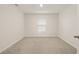 Neutrally decorated bedroom with modern window, recessed light and carpeted floor at 3834 Silver Strand Trl, Palmetto, FL 34221