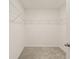 Walk-in closet featuring wire shelving and neutral carpeting at 3834 Silver Strand Trl, Palmetto, FL 34221