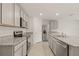 A bright kitchen with granite countertops, stainless steel appliances, and ample cabinet space at 3834 Silver Strand Trl, Palmetto, FL 34221