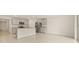 A bright, neutral kitchen with island, granite countertops, and stainless steel appliances at 3834 Silver Strand Trl, Palmetto, FL 34221