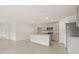 Bright kitchen features an island with a breakfast bar, granite countertops, and stainless steel appliances at 3834 Silver Strand Trl, Palmetto, FL 34221