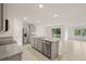 A spacious kitchen with stainless steel appliances and an island with a sink at 3834 Silver Strand Trl, Palmetto, FL 34221